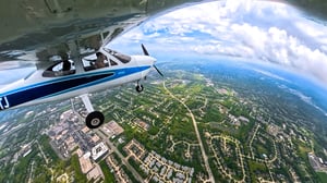 Aerial Wing View of Small Fixed-Wing Aircraft in the Sky